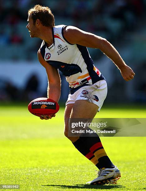 Ben Rutten of the Crows looks to handball during the round three AFL match between the Melbourne Demons and the Adelaide Crows at Melbourne Cricket...