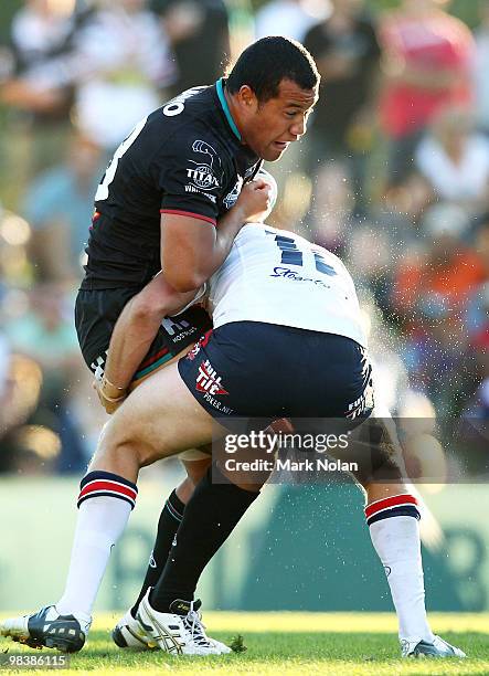 Penrith Panther player is tackled during the round five NRL match between the Penrith Panthers and the Sydney Roosters at CUA Stadium on April 11,...