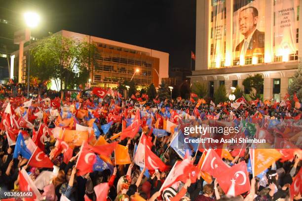 Supporters of Turkish President Recep Tayyip Erdogan gather at the ruling AK Party's headquarters on June 25, 2018 in Istanbul, Turkey. Preliminary...