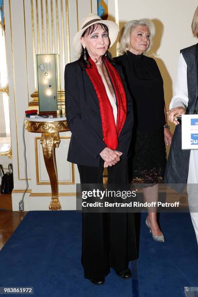 Anna Karina, decorated "Chevalier de la Legion d'Honneur" and Elisabeth Dauchy, decorated "Officier des Arts et des Lettres" attend Decorations are...