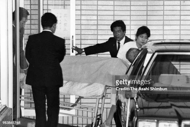 The body of former Prime Minister Nobusuke Kishi is taken out from the Tokyo Medical University Hospital after his death on August 7, 1987 in Tokyo,...