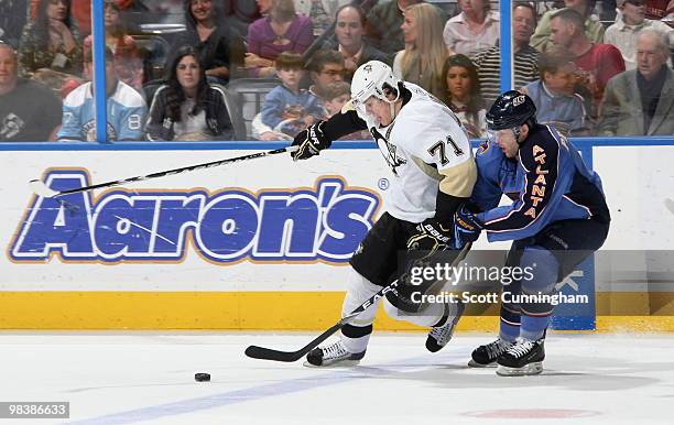 Evgeny Malkin of the Pittsburgh Penguins battles for the puck against Rich Peverley of the Atlanta Thrashers at Philips Arena on April 10, 2010 in...