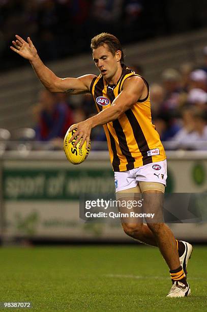 Luke Hodge of the Hawks kicks during the round three AFL match between the Western Bulldogs and the Hawthorn Hawks at Etihad Stadium on April 11,...