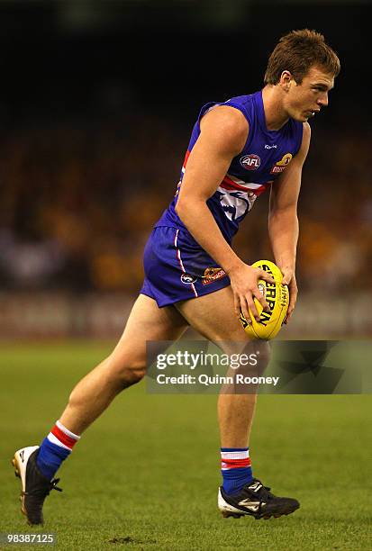 Liam Picken of the Bulldogs kicks during the round three AFL match between the Western Bulldogs and the Hawthorn Hawks at Etihad Stadium on April 11,...