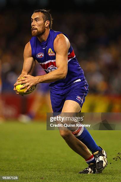 Ben Hudson of the Bulldogs kicks during the round three AFL match between the Western Bulldogs and the Hawthorn Hawks at Etihad Stadium on April 11,...