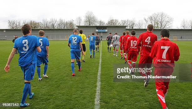 The teams of Hoffenheim and Cottbus enter the pitch prior to the DFB Juniors Cup half final between TSG 1899 Hoffenheim and FC Energie Cottbus at the...