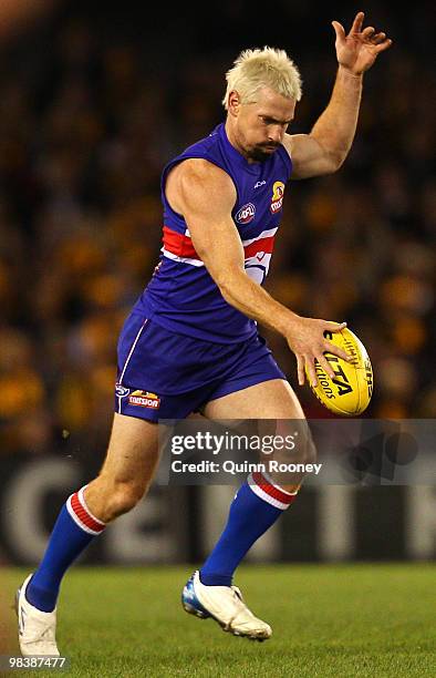 Jason Akermanis of the Bulldogs kicks during the round three AFL match between the Western Bulldogs and the Hawthorn Hawks at Etihad Stadium on April...