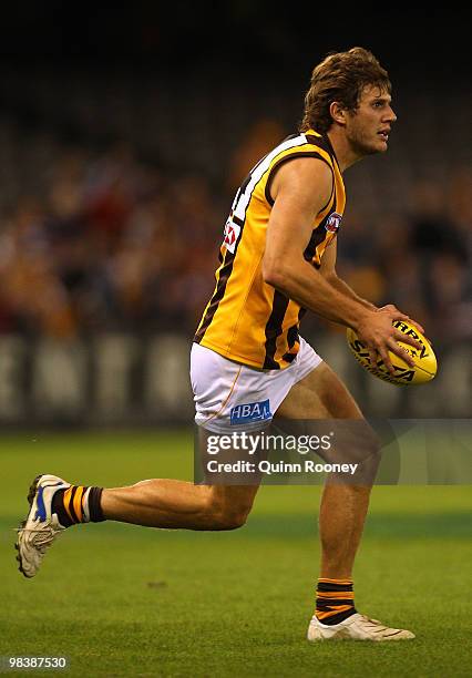 Grant Birchall of the Hawks looks to kick the ball during the round three AFL match between the Western Bulldogs and the Hawthorn Hawks at Etihad...