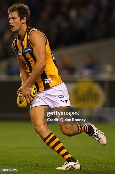 Stephen Gilham of the Hawks kicks during the round three AFL match between the Western Bulldogs and the Hawthorn Hawks at Etihad Stadium on April 11,...