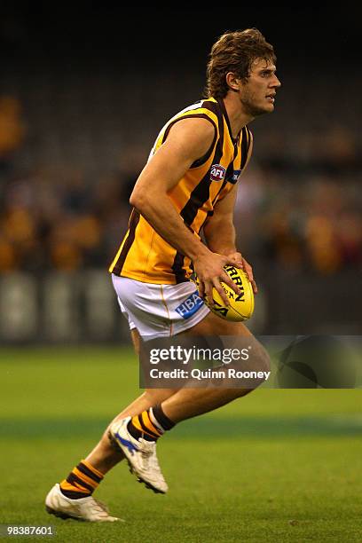 Grant Birchall of the Hawks looks to kick during the round three AFL match between the Western Bulldogs and the Hawthorn Hawks at Etihad Stadium on...