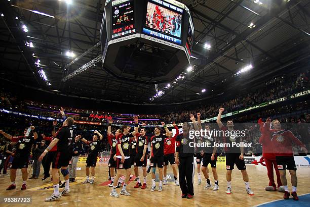The team of Luebbecke celebrates after winning the DHB Cup third place match between VfL Gummersbach and TuS N-Luebbecke at the Color Line Arena on...