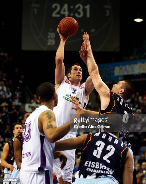 Christopher McNaughton of Goettingen tries to score against Andrew Drevo of Bremerhaven during the third place game between BG Goettingen and...