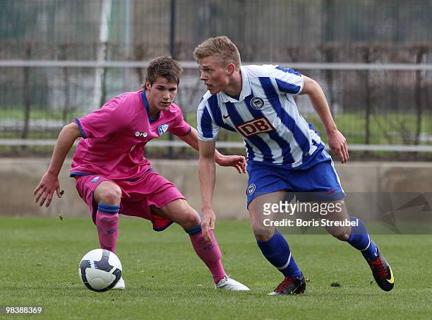 Patrick Breitkreuz of Berlin battles for the ball with Marius Walther of Bochum during the DFB Juniors Cup half final between Hertha BSC Berlin and...