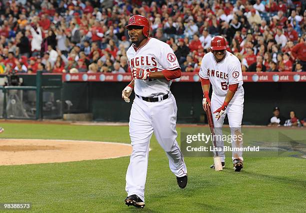 Howie Kendrick of the Los Angeles Angels of Anaheim runs to the dugout after scoring in the fourth inning against the Oakland Athletics on April 10,...