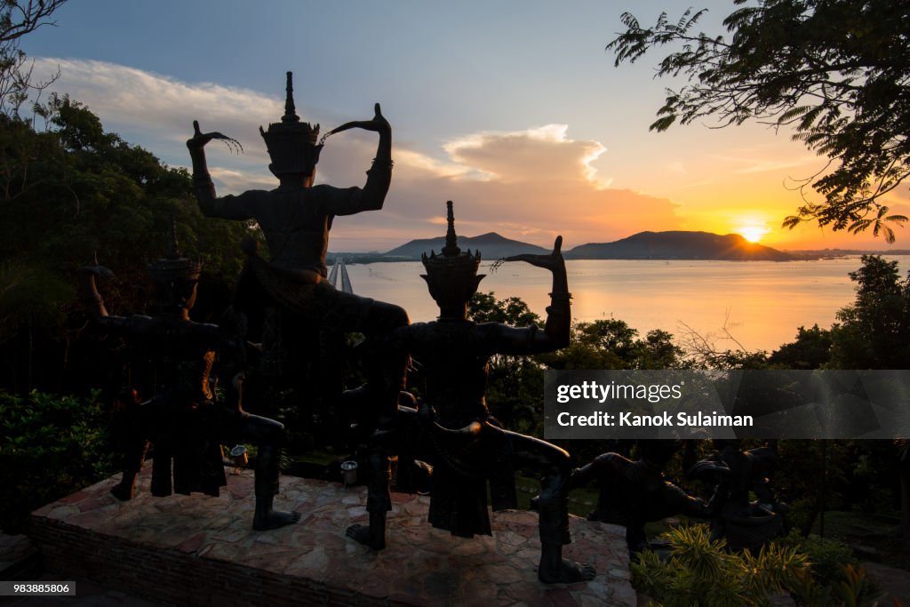 Statue with sunrise