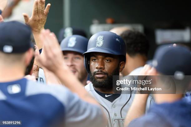 Denard Span of the Seattle Mariners celebrates scoring on Dee Gordon single in the third inning during a baseball game against the Baltimore Orioles...