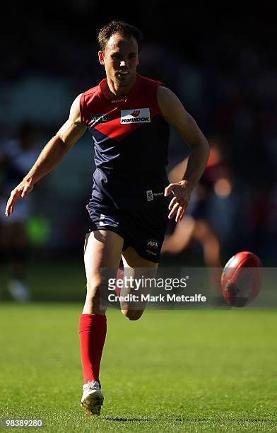 Cameron Bruce of the Demons attacks the ball during the round three AFL match between the Melbourne Demons and the Adelaide Crows at Melbourne...