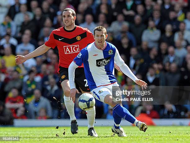 Blackburn Rovers' Australian midfielder Brett Emerton vies with Manchester United's Irish defender John O'Shea during the English Premier League...