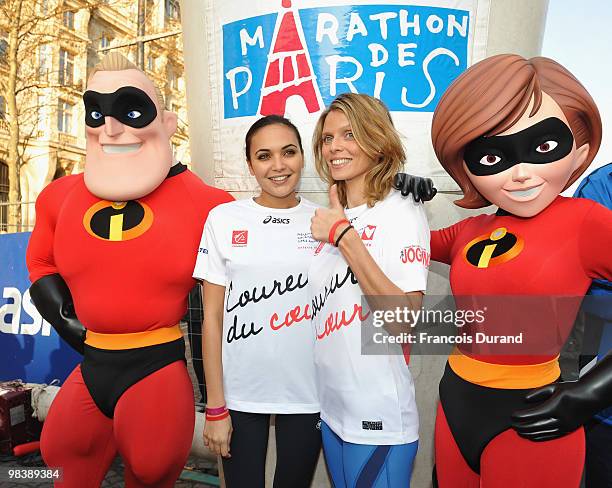 Valerie Begue and Sylvie Tellier pose with the cartoon characters Mr. Invincible and Elastigirl at the start of the Paris Marathon 2010 on April 11,...