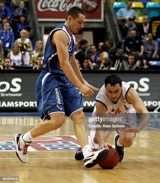 Dominik Bahiense de Mello of Frankfurt is challenged by Predrag Suput of Brose Baskets during the final between Deutsche Bank Skyliners Frankfurt and...