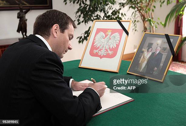 Hungarian Prime Minister Gordon Bajnai signs the book of condolence in the Polish embassy in Budapest on April 11, 2010 after a plane carrying Polish...