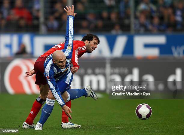 Ruud van Nistelrooy of Hamburg and Milos Maric of Bochum battle for the ball during the Bundesliga match between VfL Bochum and Hamburger SV at...