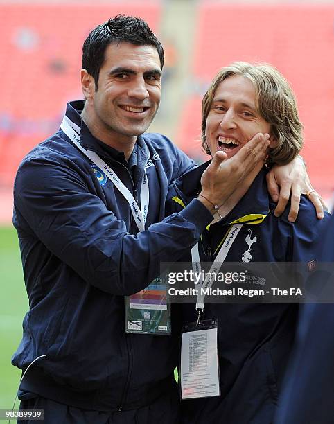 Ricardo Rocha of Portsmouth jokes with Luka Modric of Tottenham Hotspur ahead of the FA Cup sponsored by E.ON Semi Final match between Tottenham...