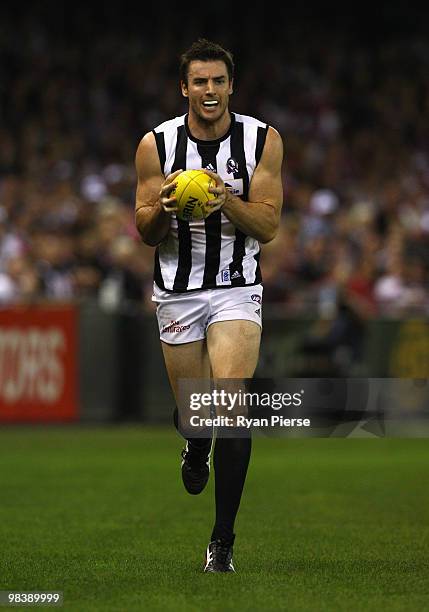 Darren Jolly of the Magpies marks during the round three AFL match between the St Kilda Saints and the Collingwood Magpies at Etihad Stadium on April...