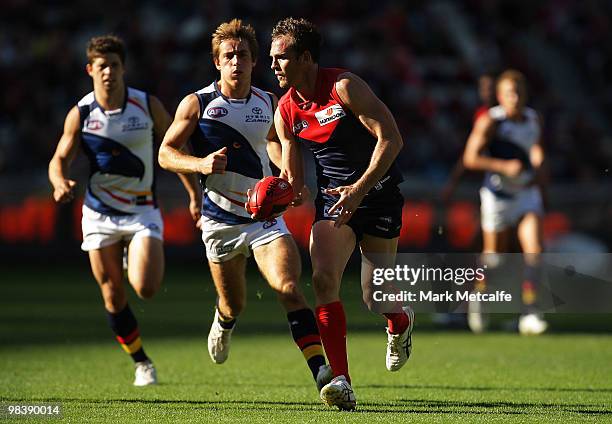 Cameron Bruce of the Demons leads looks for a teammate during the round three AFL match between the Melbourne Demons and the Adelaide Crows at...