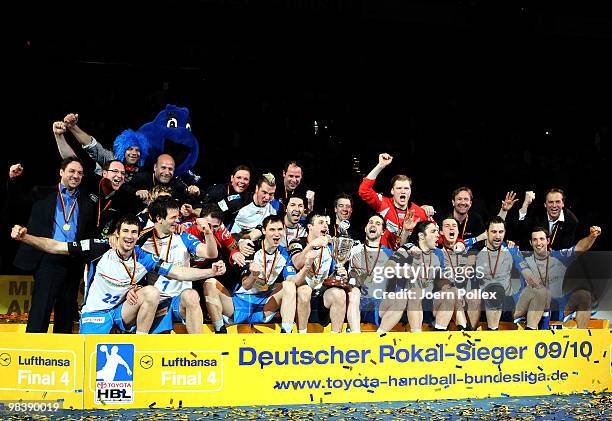 The team of Hamburg celebrates after winning the DHB Cup Final match between Rhein-Neckar Loewen and HSV Hamburg at the Color Line Arena on April 11,...
