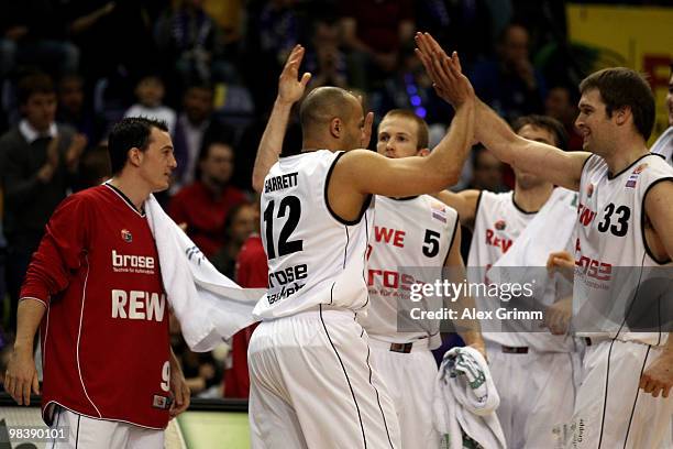 Robert Garrett of Brose Baskets is celebrated by team mates during the final between Deutsche Bank Skyliners Frankfurt and Brose Baskets Bamberg at...