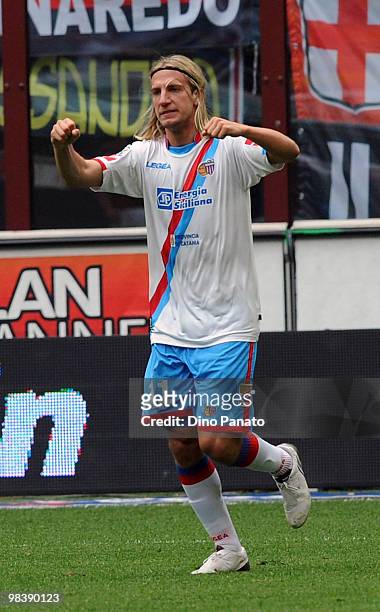 Maxi Lopez of Catania celebrates after scoring his first catania's goal during the Serie A match between AC Milan and Catania Calcio at Stadio...