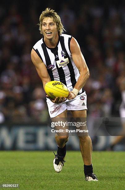 Dale Thomas of the Magpies handballs during the round three AFL match between the St Kilda Saints and the Collingwood Magpies at Etihad Stadium on...