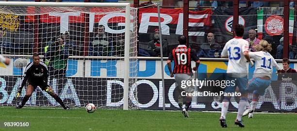 Maxi Lopez of Catania scores his first catania's goal during the Serie A match between AC Milan and Catania Calcio at Stadio Giuseppe Meazza on April...