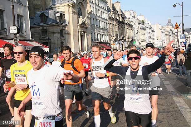 Competitors run during the 34th Paris Marathon on April 11, 2010 in Paris, France.