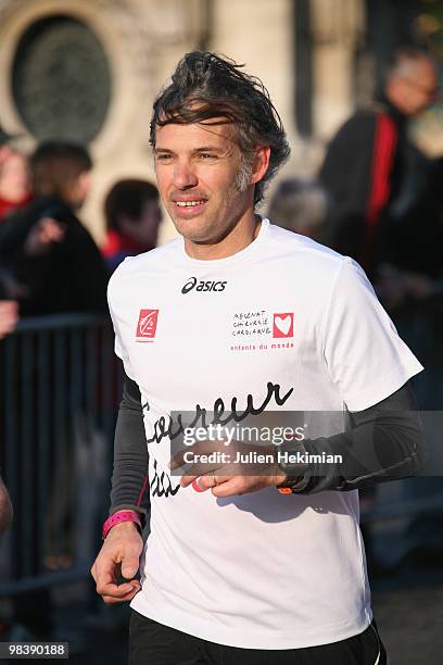 Paul Belmondo runs for the 'Mecenat Chirurgie Cardiaque' association during the Paris marathon on April 11, 2010 in Paris, France.