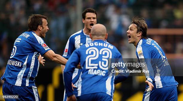 Zlatko Dedic of Bochum celebrates with his team mates after scoring his team's first goal during the Bundesliga match between VfL Bochum and...