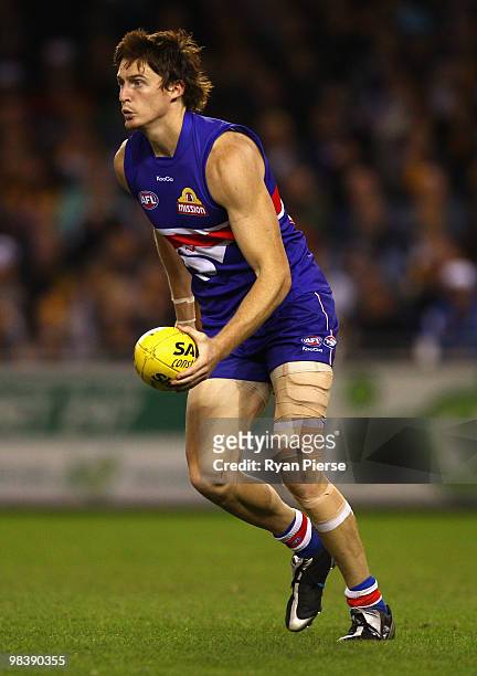 Tom Williams of the Bulldogs looks upfield during the round three AFL match between the Western Bulldogs and the Hawthorn Hawks at Etihad Stadium on...