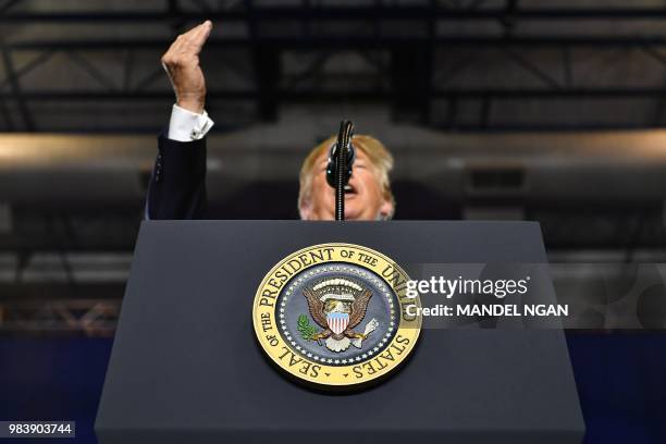 President Donald Trump speaks at a rally for South Carolina Governor Henry McMaster at Airport High School in West Columbia, South Carolina, on June...