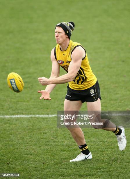 Jack Riewoldt handballs during a Richmond Tigers AFL media opportunity at Punt Road Oval on June 26, 2018 in Melbourne, Australia.