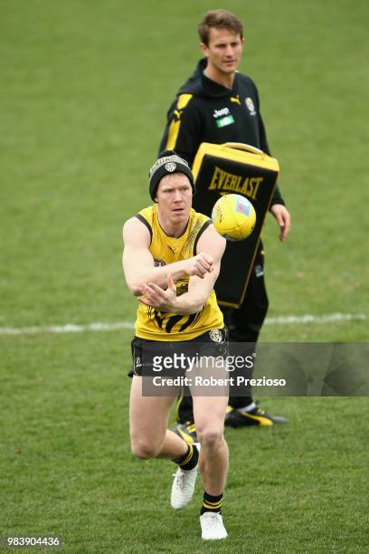 Jack Riewoldt handballs during a Richmond Tigers AFL media opportunity at Punt Road Oval on June 26, 2018 in Melbourne, Australia.