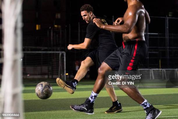 Player Klay Thompson of the Golden State Warriors play soccer with his friends on June 24, 2018 in Beijing, China.