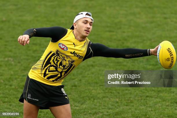 Shai Bolton gathers the ball during a Richmond Tigers AFL media opportunity at Punt Road Oval on June 26, 2018 in Melbourne, Australia.