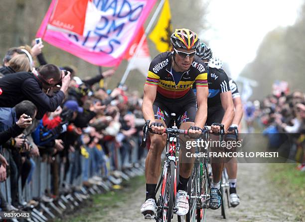 Belgian Tom Boonen leaves the cobblestone section "La tranchée d'Aramberg" during the 108th edition of the Paris-Roubaix cycling race between...