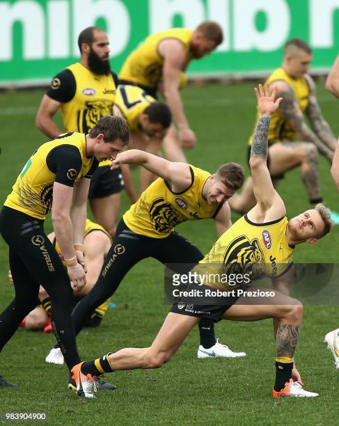 Brandon Ellis stretches during a Richmond Tigers AFL media opportunity at Punt Road Oval on June 26, 2018 in Melbourne, Australia.