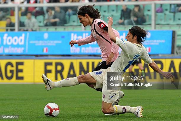 Edinson Cavani of Palermo and Manuel Iori of Chievo compete for the ball during the Serie A match between US Citta di Palermo and AC Chievo Verona at...