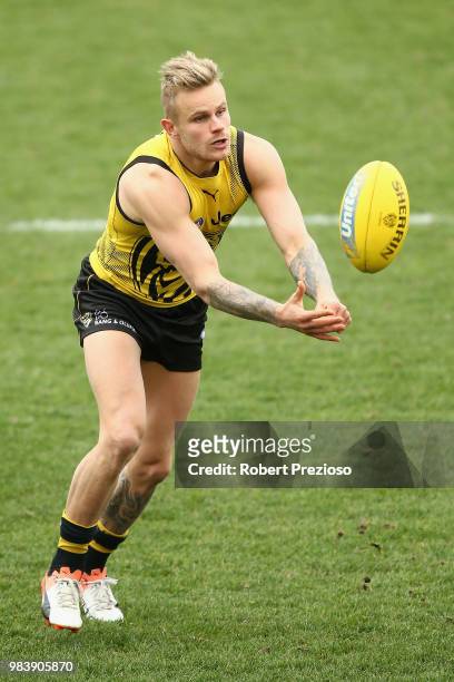 Brandon Ellis handballs during a Richmond Tigers AFL media opportunity at Punt Road Oval on June 26, 2018 in Melbourne, Australia.