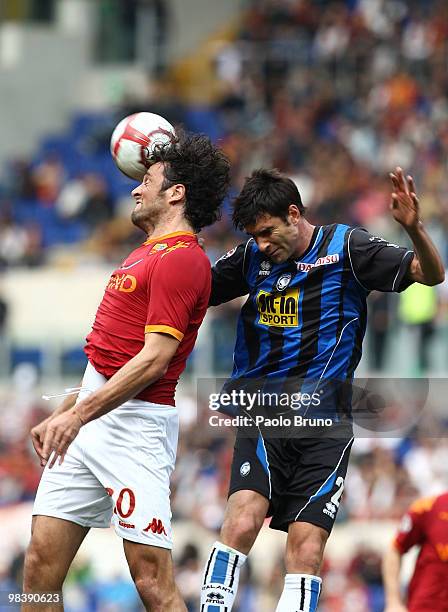 Luca Toni of AS Roma and Maximiliano Pellegrino of Atalanta BC in action during the Serie A match between AS Roma and Atalanta BC at Stadio Olimpico...