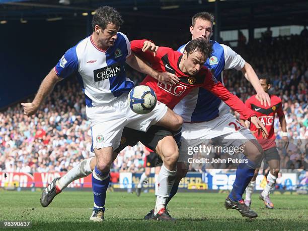 Dimitar Berbatov of Manchester United clashes with Ryan Nelsen and Phil Jones of Blackburn Rovers during the Barclays Premier League match between...