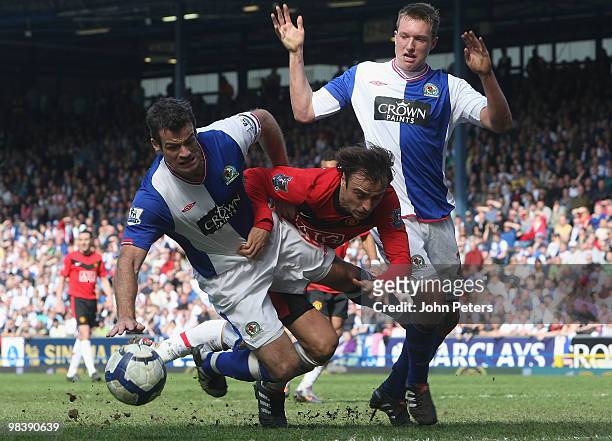 Dimitar Berbatov of Manchester United clashes with Ryan Nelsen and Phil Jones of Blackburn Rovers during the Barclays Premier League match between...